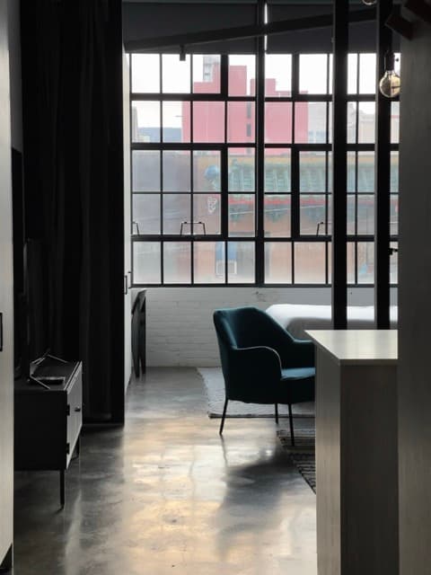 Modern steel-frame windows integrating contemporary design in classic space